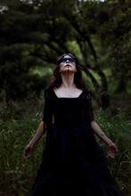 Witch In Black Dress In Dark Forest