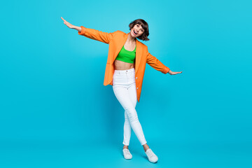 Sticker - Full body photo of funky young brunette lady dance wear blazer top jeans shoes isolated on teal color background