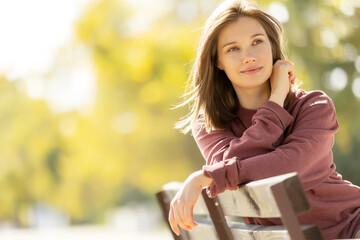 Wall Mural - Beautiful woman. Young girl portrait in nature in autumn. High quality photo