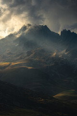  Beautiful dramatic light behind and on the mountains of the French Alps.