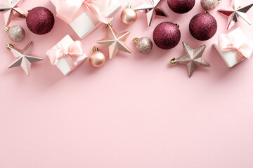 Modern Christmas background with gift boxes, balls, stars on pink. Flat lay, top view.