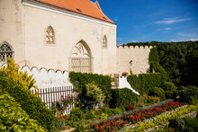 Vranov nad dyji, Southern Moravia, Czech Republic, 03 July 2021: baroque and gothic medieval castle with Chapel of the Holy Trinity on hill at sunny summer day, stone tower against the blue sky