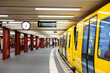 Modern subway. Yellow train at the station