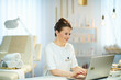 © Alliance - smiling 40 years old woman worker in beauty studio working