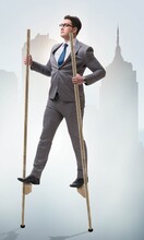 Businessman Walking On Stilts - Standing Out From The Crowd