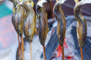 grilled ayu fish with salt on the brazier