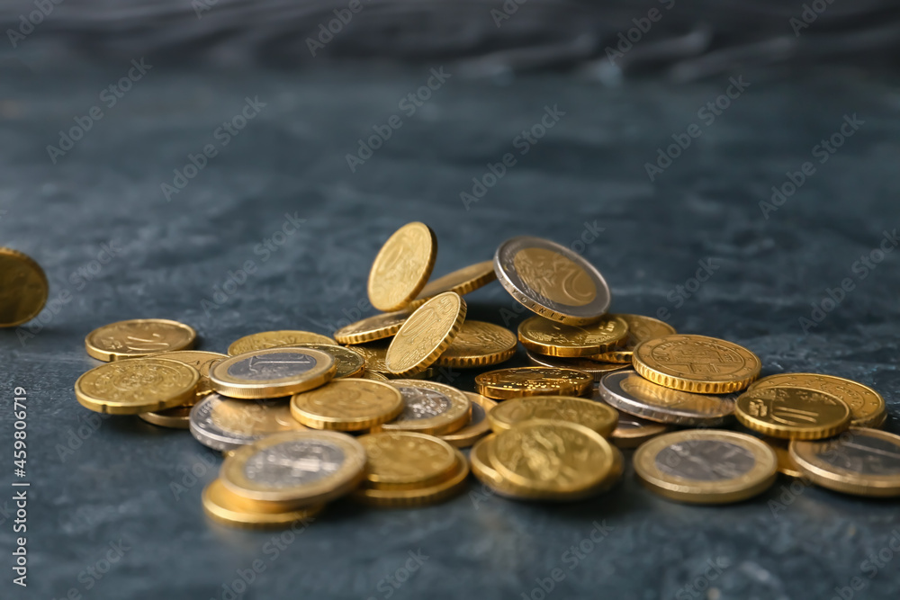 Golden coins on dark background