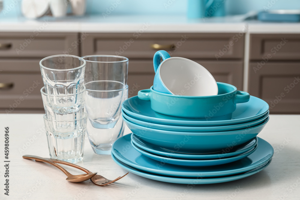 Set of clean dishes on table in kitchen Stock Photo | Adobe Stock