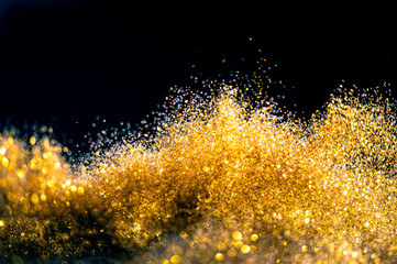 Wall Mural - glitter bombs grunge, gold glitter defocused abstract twinkly lights background.