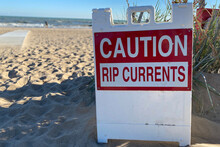 Caution Rip Currents Sign At Entrance Of A Lake Michigan Beach
