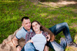 © Beliakina Ekaterina - A young couple, a guy and a girl, relax in the park in the summer