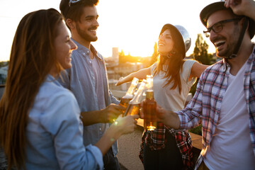 Wall Mural - Group of young friends enjoying outdoor summer party