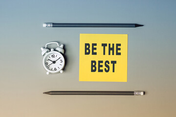 Be the best - text on sticky note paper. Closeup of a personal agenda. Top view