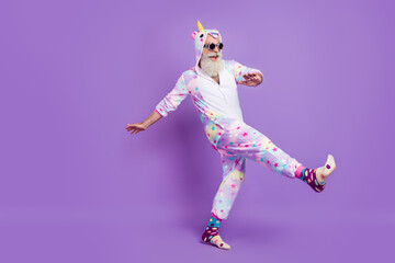 full length body size view of nice funny cheerful man in pajama walking having fun isolated over vio