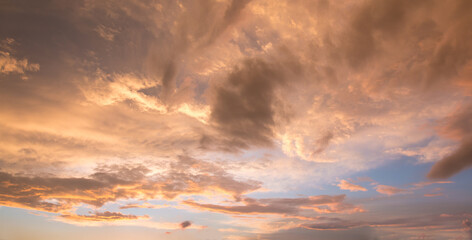 Wall Mural - bright sunset scenery with yellow and orange shiny clouds