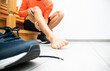 © SkyLine - The runner is preparing for running and revealed the his leg is hurting