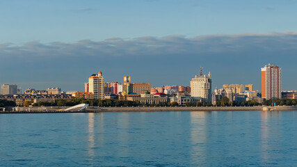 View of the embankment of the city of Heihe, China from the city of Blagoveshchensk, Russia. Border river Amur in the autumn morning.