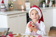 © Tomsickova - Cute blond child, boy and his mom, baking christmas cookies at home