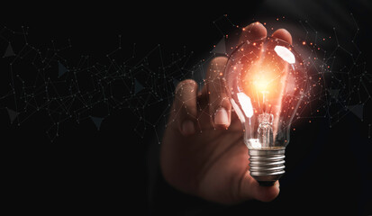 Fototapete - Businessman holding lightbulb glowing with connection line for creative thinking ideas and innovation concept.