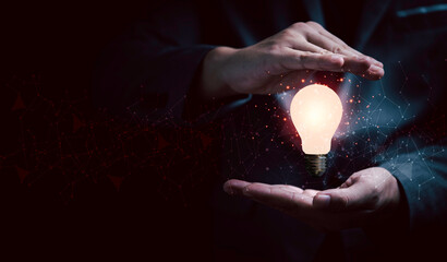 Poster - businessman hand protecting lightbulb glowing with connection line for creative thinking ideas and i