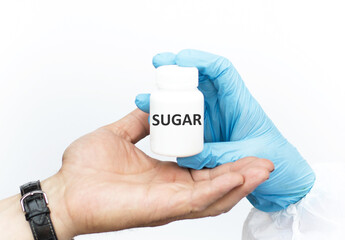 Medicine concept. Jar with text Sugar, doctor's hands pass jar to patients on white background