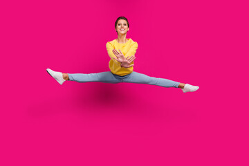 Wall Mural - Full length body size view of attractive sportive cheerful girl jumping dancing twine isolated over bright pink color background