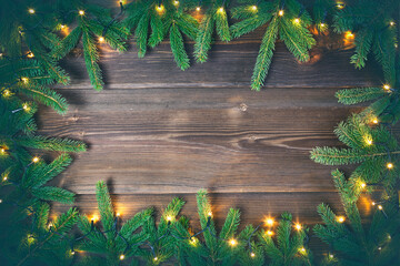 Poster - Christmas decoration. Fir tree frame on rustic, wooden background. High angle view.