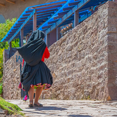 Wall Mural - Indigenous Quechua woman in traditional clothing, Taquile Island, Titicaca Lake, Peru.