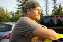 Portrait Of Man Next To Pickup Truck In Forest