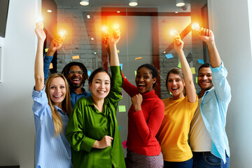 Teamwork of business person holds illuminated lightbulbs