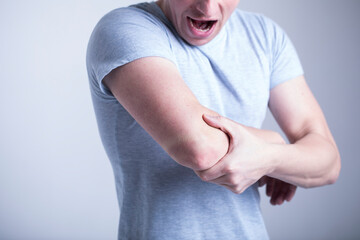 man with pain in his neck. Pain hand. Male. Medicine. 