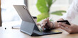 © wichayada - Close up woman hand using credit card and smartphone laptop for buying online shopping