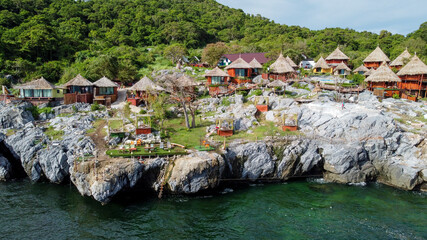 Aerial view from drone of Paree Hut resort in Si Chang island, Thailand with features accommodation on private balconies and outdoor pool 