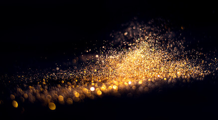 Wall Mural - blurred glitter bombs, gold glitter defocused abstract twinkly lights grunge background.