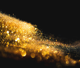 Wall Mural - blurred glitter bombs, gold glitter defocused abstract twinkly lights grunge background.