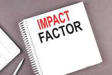 IMPACT FACTOR Text On Notebook With Calculator And Pen,business Concept