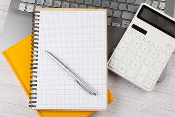 Poster - office desk table with laptop, notebooks,and calculator,copy space