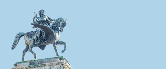 Wall Mural - Banner with statue of Greek goddess Muse riding winged horse Pegasus in historical, touristic downtown in Vienna Austria at blue sky background and copy space. Concept of Cultural Heritage and Travel.