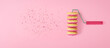 Creative banner with empty space.Painted donut roller on a pink background. Top view.