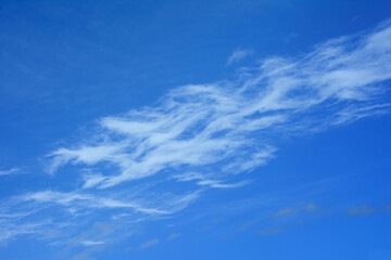 Wall Mural - Cirrus clouds and a pattern of them, at a high altitude in the sky.