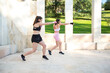 © luisrojasstock - couple of young caucasian women doing boxing exercises outdoor