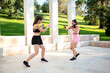 © luisrojasstock - couple of young caucasian women practicing boxing outdoor