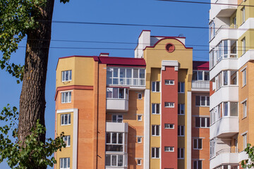 Facade of a residential building and windows in the city