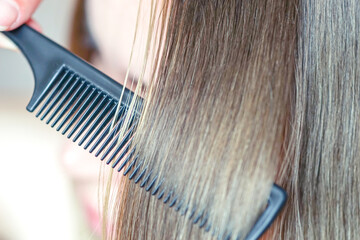 the process of combining a fine black comb for medium brown hair with a silver shine