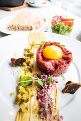 Wall Mural - Tasty Steak tartare (Raw beef) - classic steak tartare on white plate