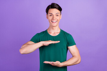 Poster - Photo of amazed excited happy positive man hands empty space measure isolated on violet color background