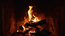 Burning Fire In The Fireplace. Slow Motion. A Looping Clip Of A Fireplace With Medium Size Flames Winter And Christmas Holidays Concept