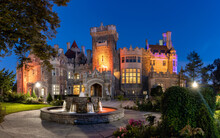 Beautiful Gothic Revival Style Mansion And Fountain At Dusk. Toronto Ontario