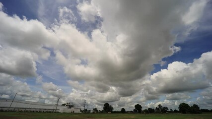 Wall Mural - 4K-Timelapse, Sky with the stormy cloud of rain over the rice field.