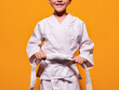 © ADDICTIVE STOCK - Boy tightening kimono belt knot
